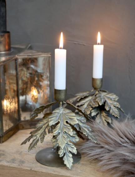 Antique bronze candlestick with gold leaves